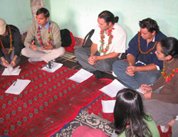 Meeting with youth in a Nepalese village in 2007 with two young people I took over to share the experience.